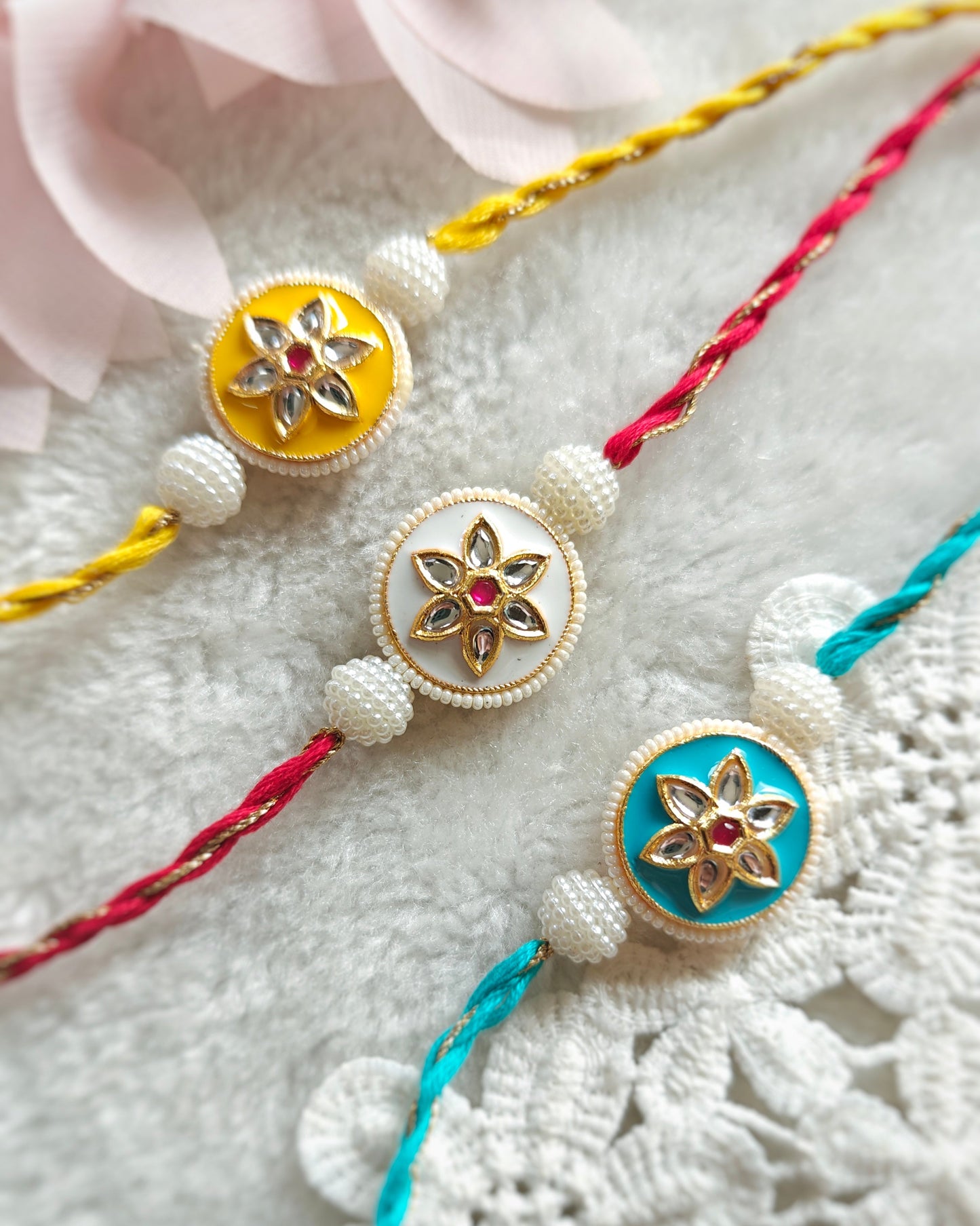 floral pearl kundan rakhi for brother in yellow white and blue colors handmade rakhi 2026