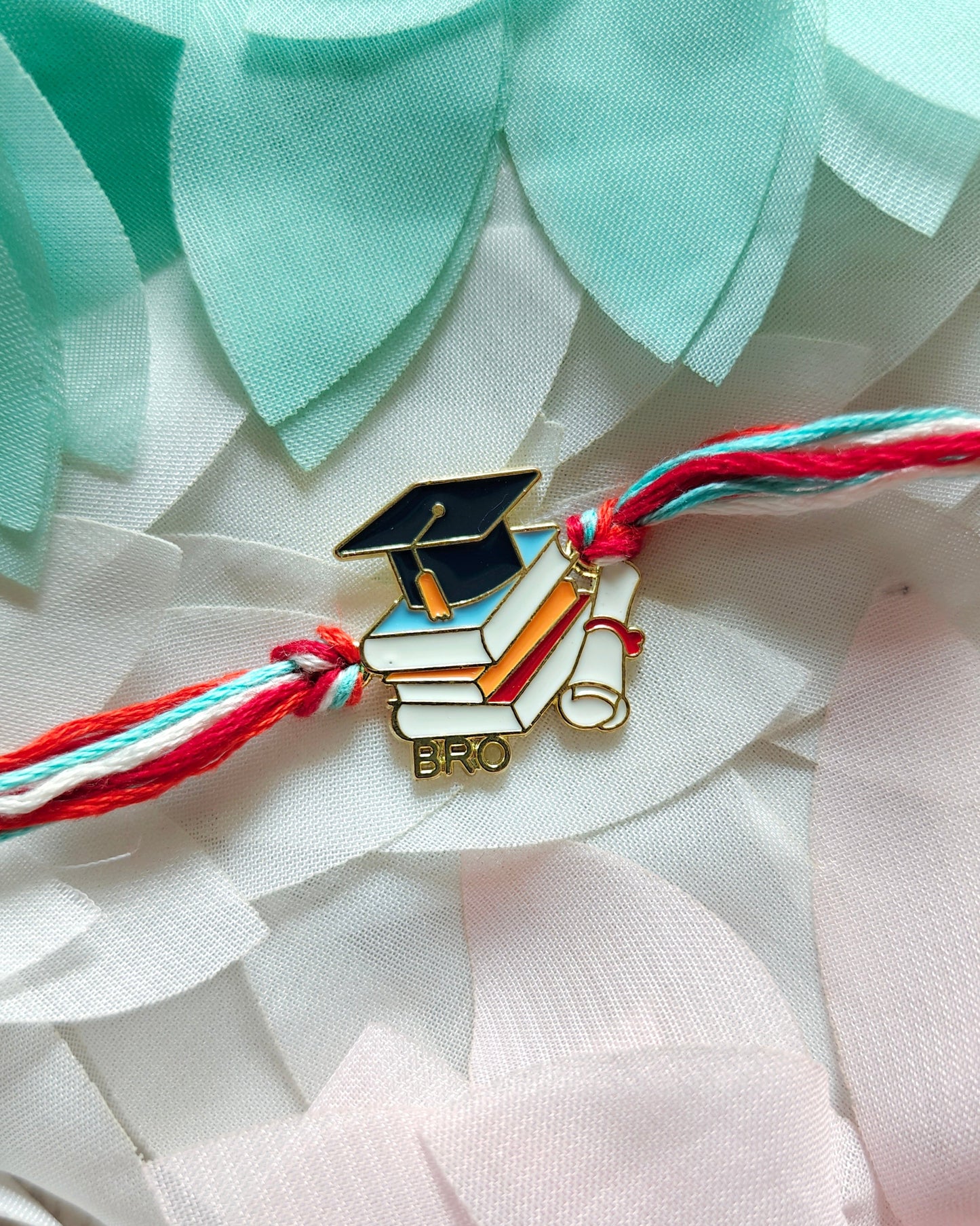 graduation rakhi for brother with books and cap design handmade rakhi 2026