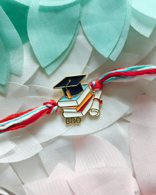 graduation rakhi for brother with books and cap design handmade rakhi 2026