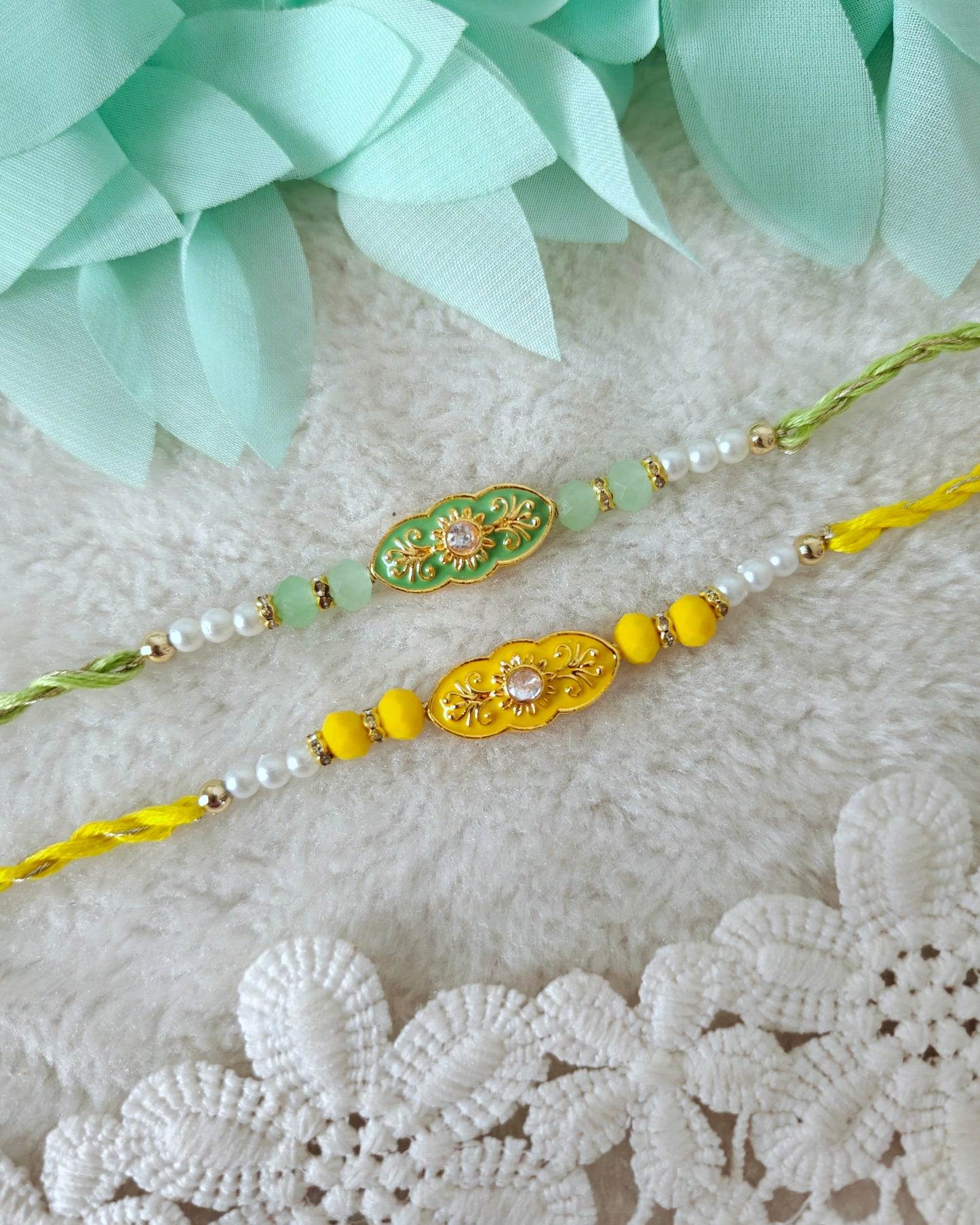 Elegant pearl rakhi with ornate oval centerpiece, pastel beads and twisted threads on soft background