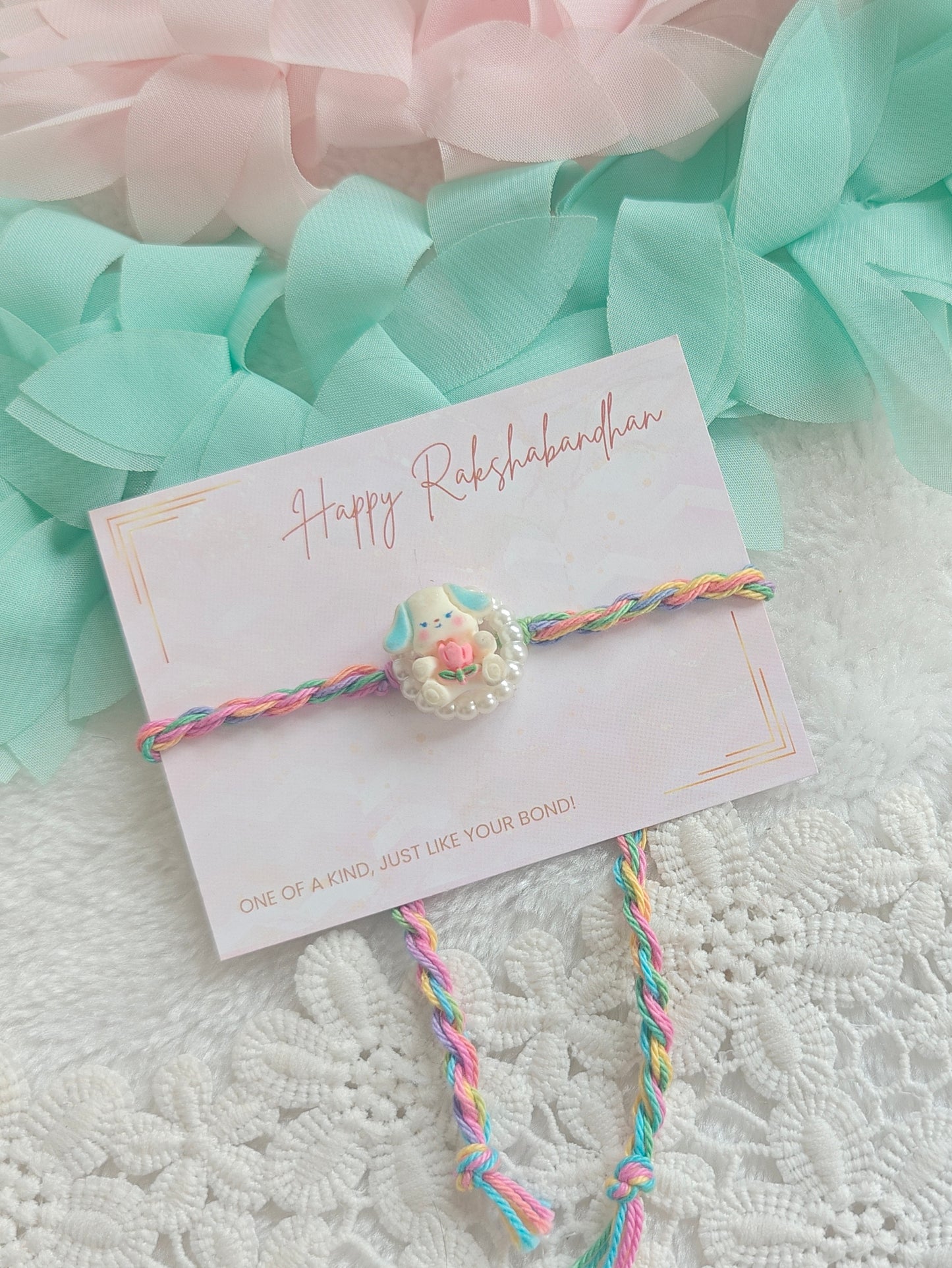 Pastel Puppy Pearl Kids Rakhi