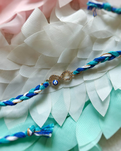 infinity evil eye rakhi for brother minimal premium rakhi with blue and gold thread