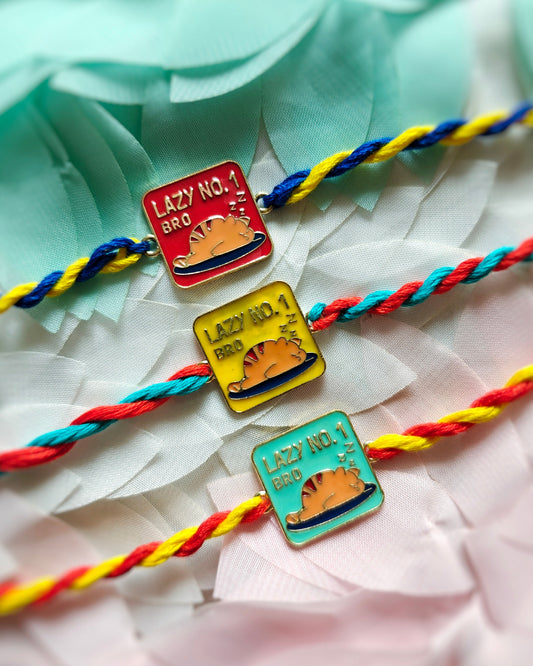 lazy no 1 bro rakhi on wrist with light blue and orange thread funny cartoon rakhi for brother