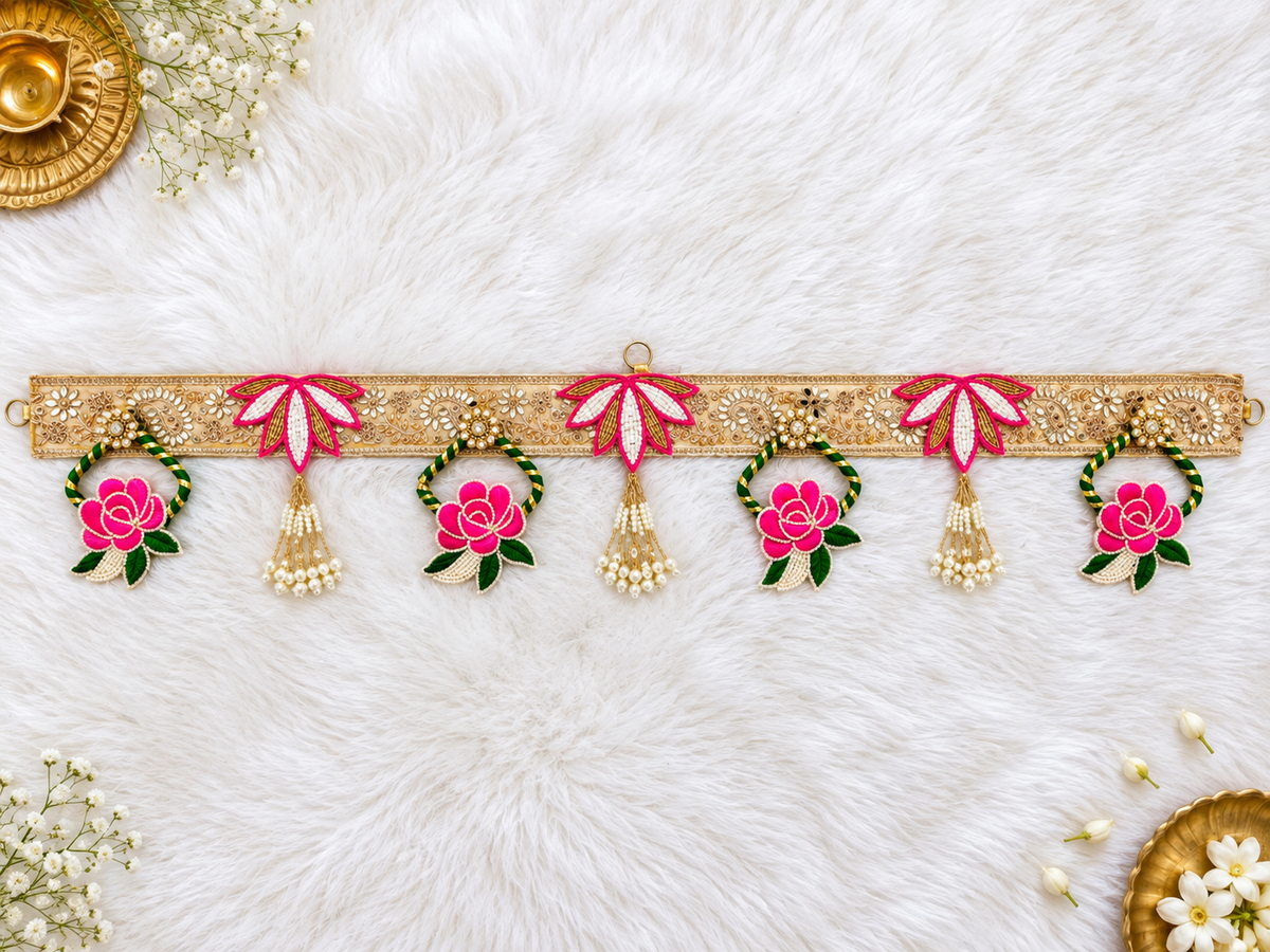 Handcrafted floral door toran with pink rose motifs, embroidery and pearl tassels