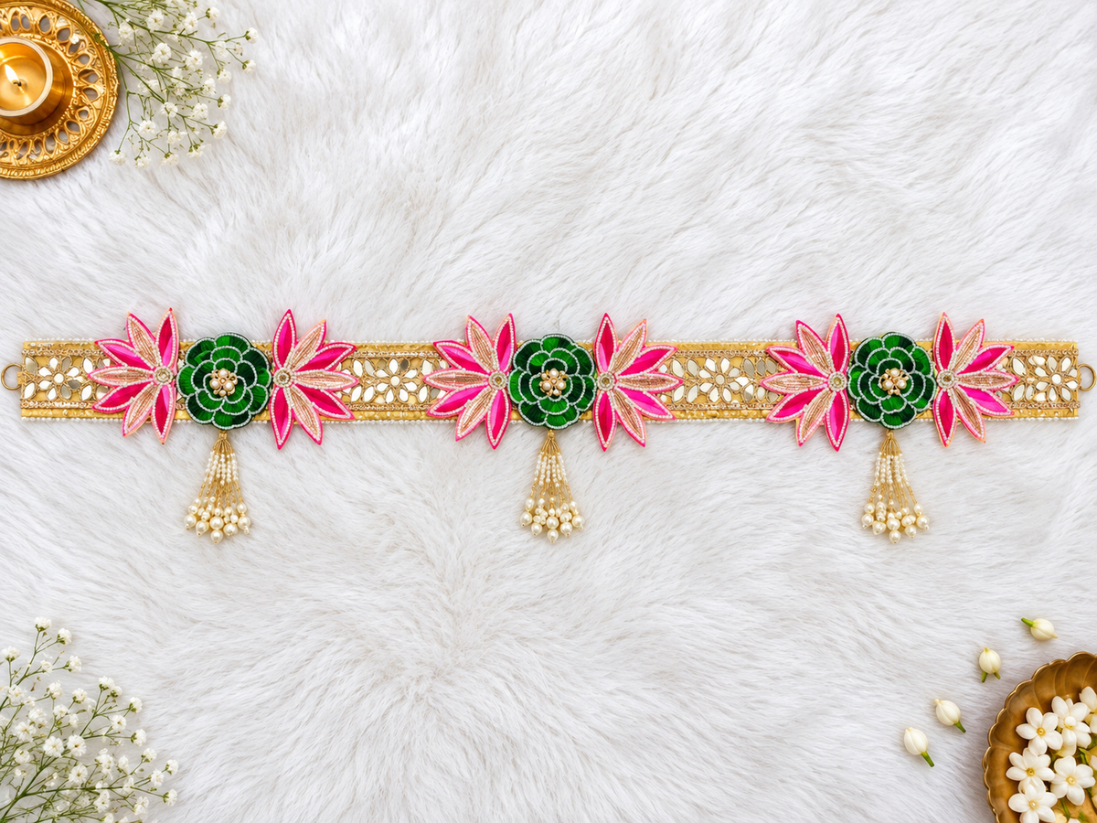 Handmade pink and green floral toran with gold embroidery and pearl tassels
