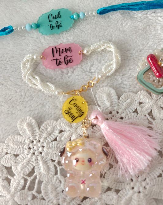 mom to be dad to be rakhi bracelet pair  with coming soon charm